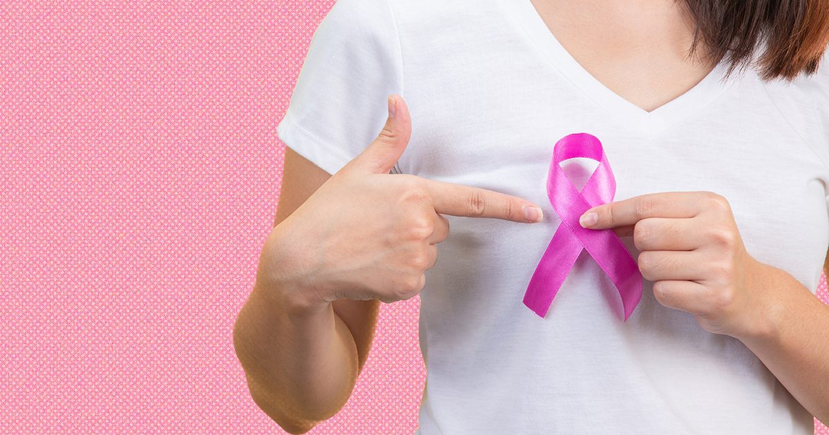 Breast cancer month, a woman in a white T-shirt with a satin pin