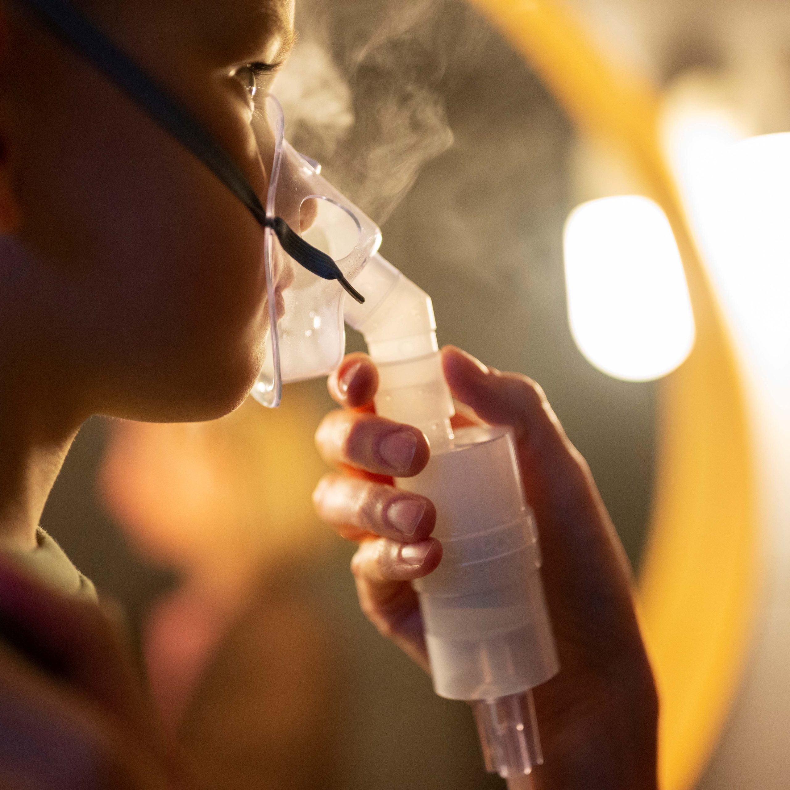 side-view-boy-using-nebulizer–1—1-